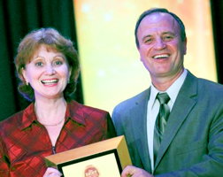 Irina and George Arabagi receiving an award